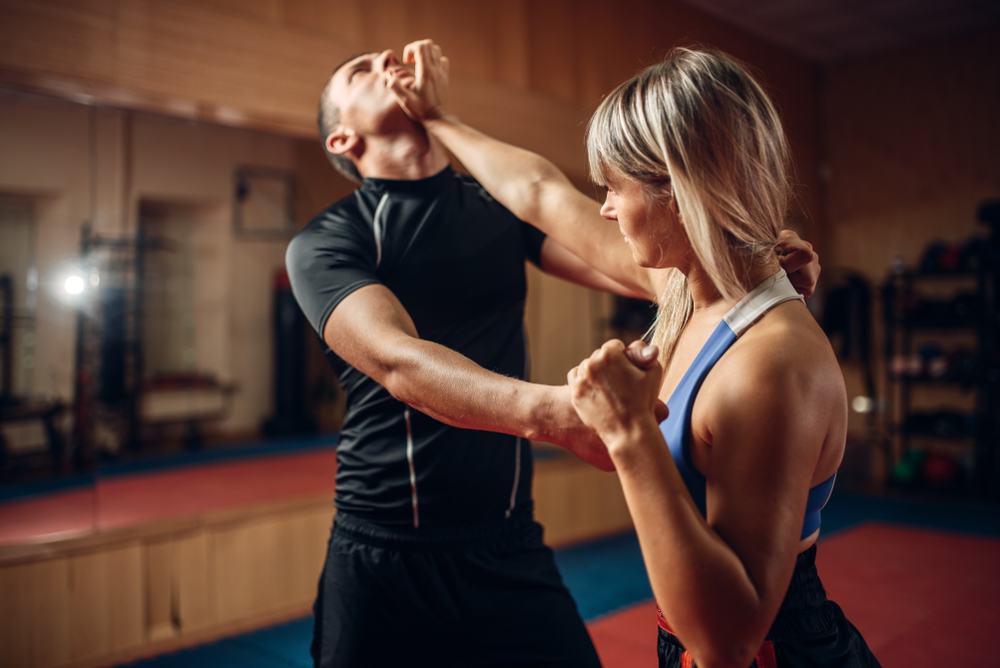Female,Person,On,Self-defense,Workout,With,Trainer
